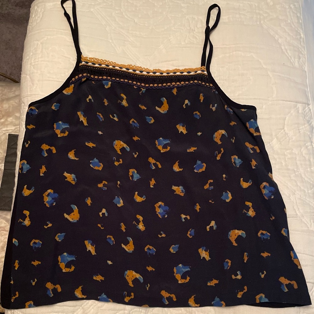 Anthropologie stylish tank with gold and blue accents .